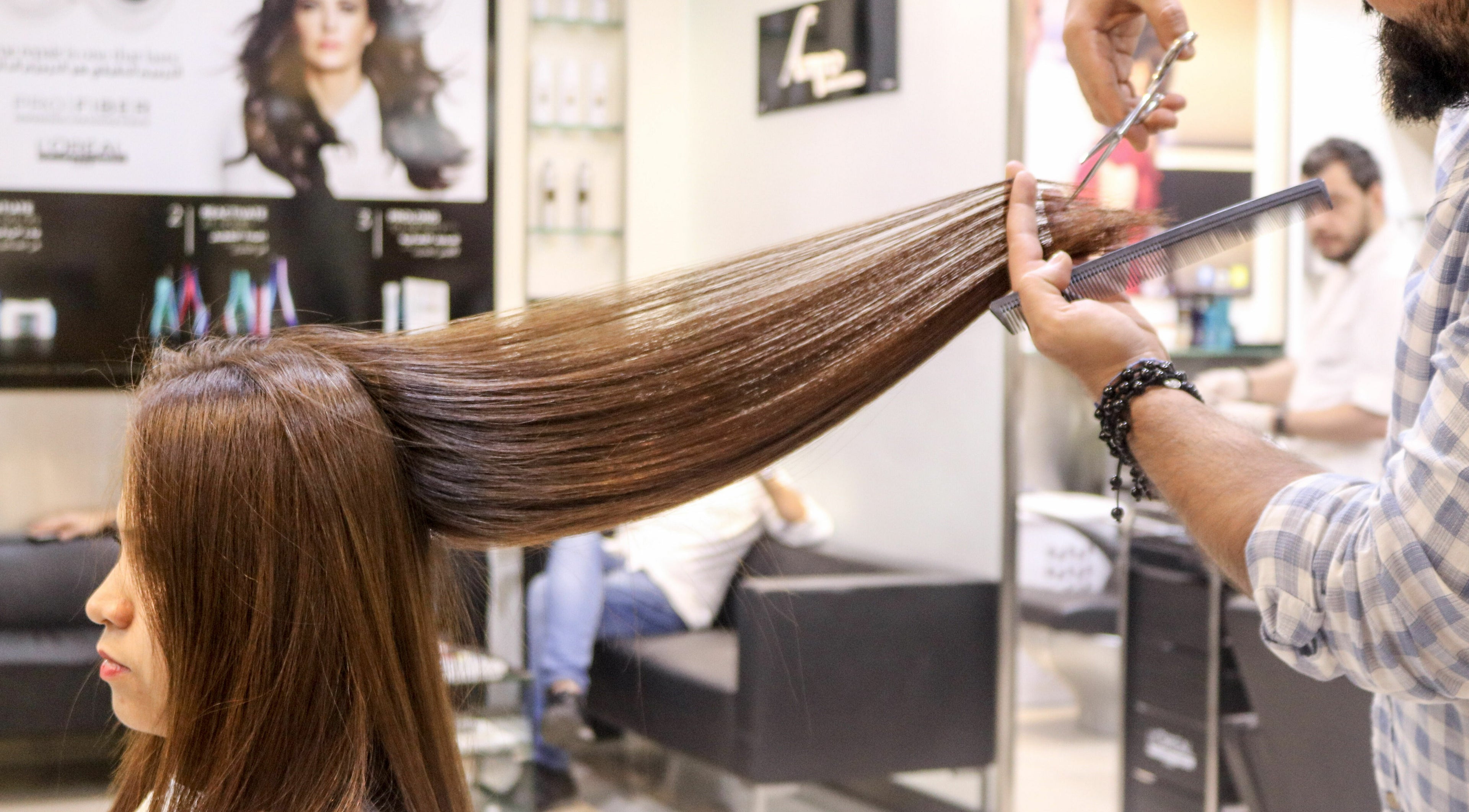 Stylist providing precision haircut at Amro - Hilton Dubai Palm Jumeirah, Dubai, Dubai, AE.