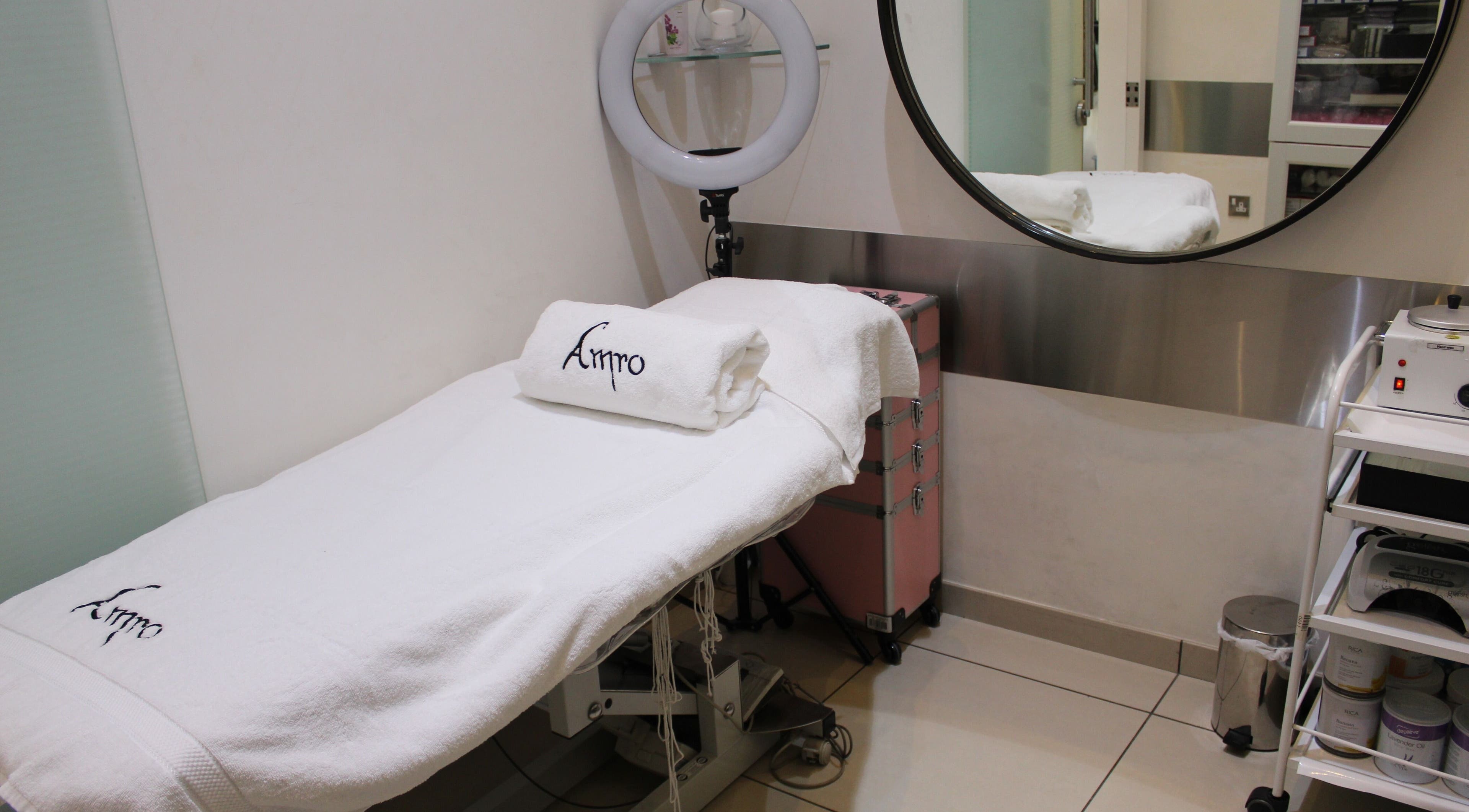 Treatment room at Amro - St.Regis Saadiyat Island - Abu Dhabi, featuring a plush bed and serene decor.