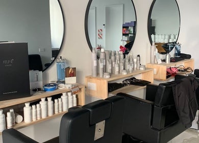 Modern salon interior at Trends Hair Beauty and Nails, Christchurch, Canterbury, NZ with styling chairs and products.