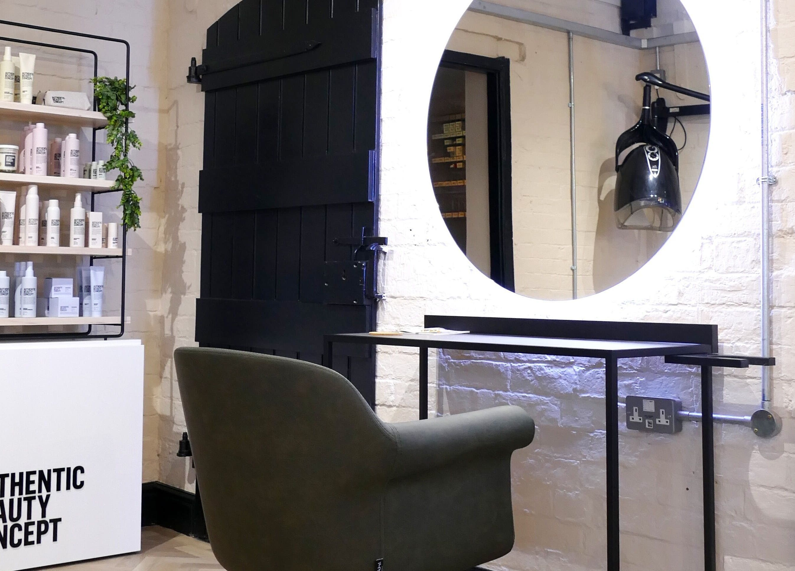 The Curl Girl in Sugnall, England, GB features a modern styling chair and product display.