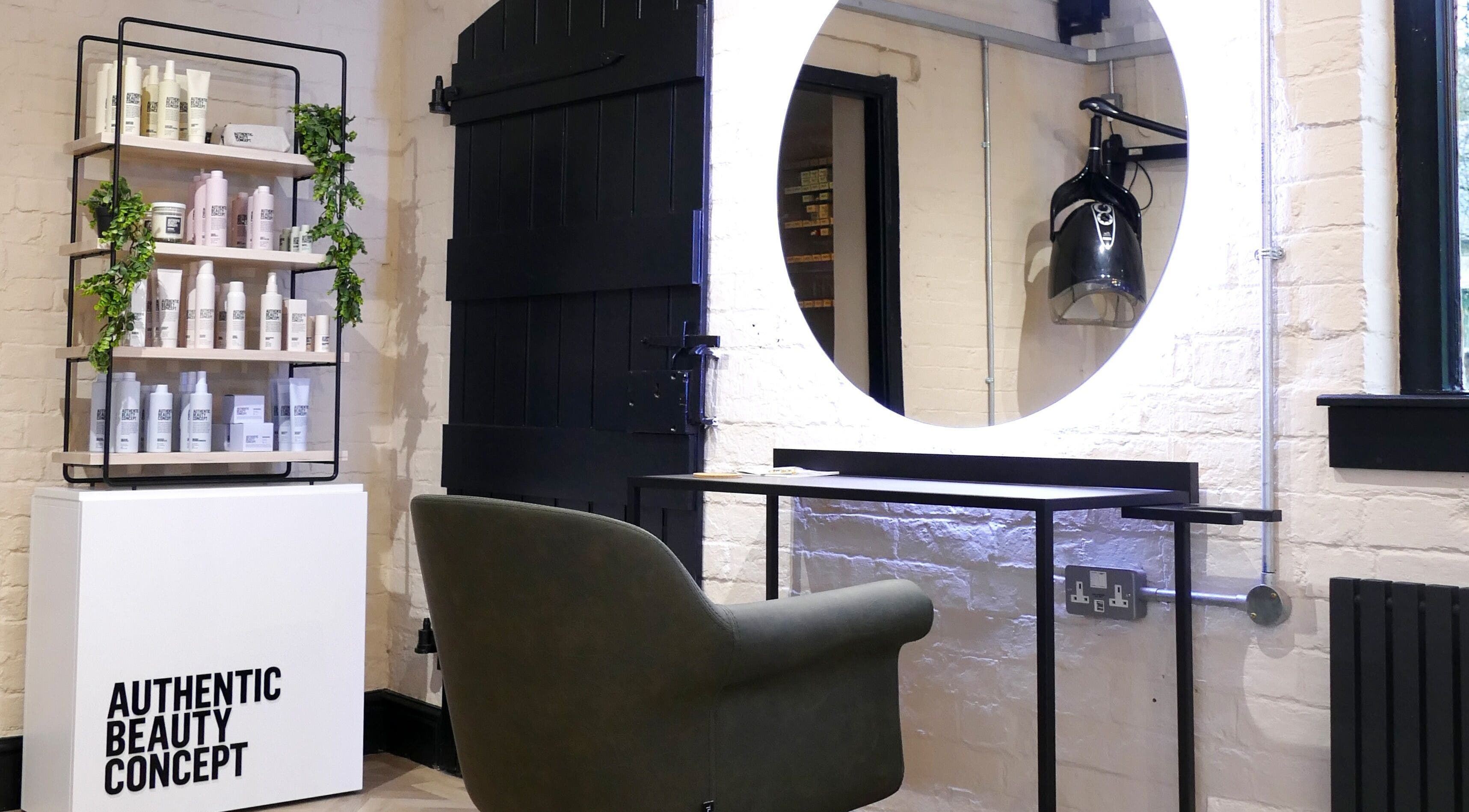 The Curl Girl in Sugnall, England, GB features a modern styling chair and product display.
