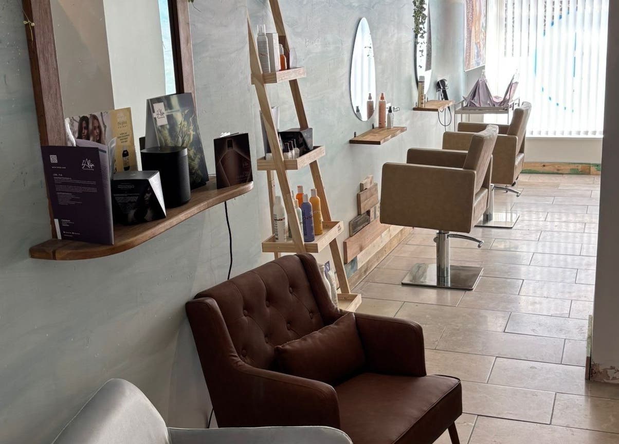Elegant salon chairs and mirrors inside The Curl Girl Devon, Braunton, England, GB.