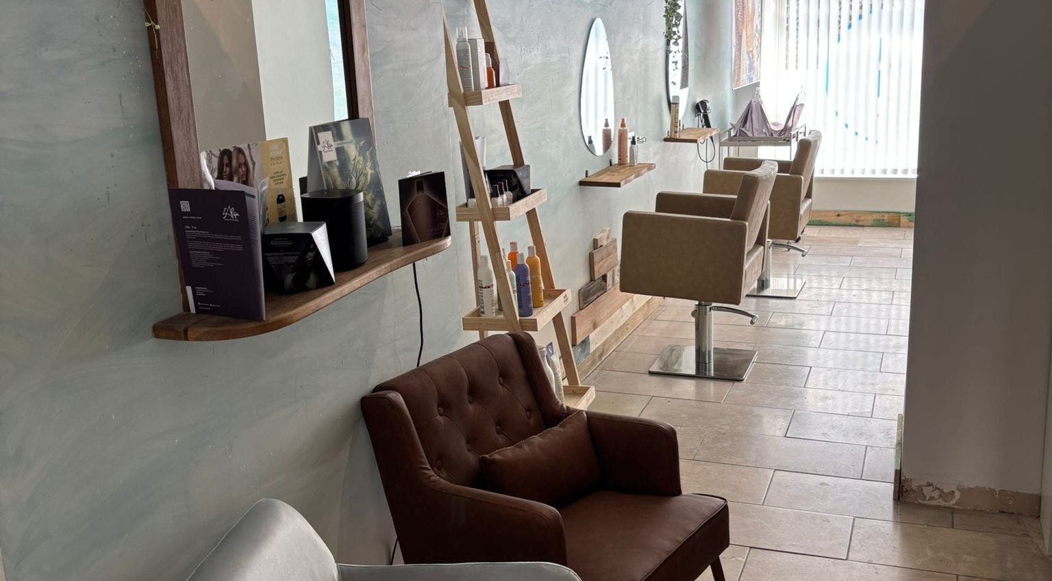 Elegant salon chairs and mirrors inside The Curl Girl Devon, Braunton, England, GB.
