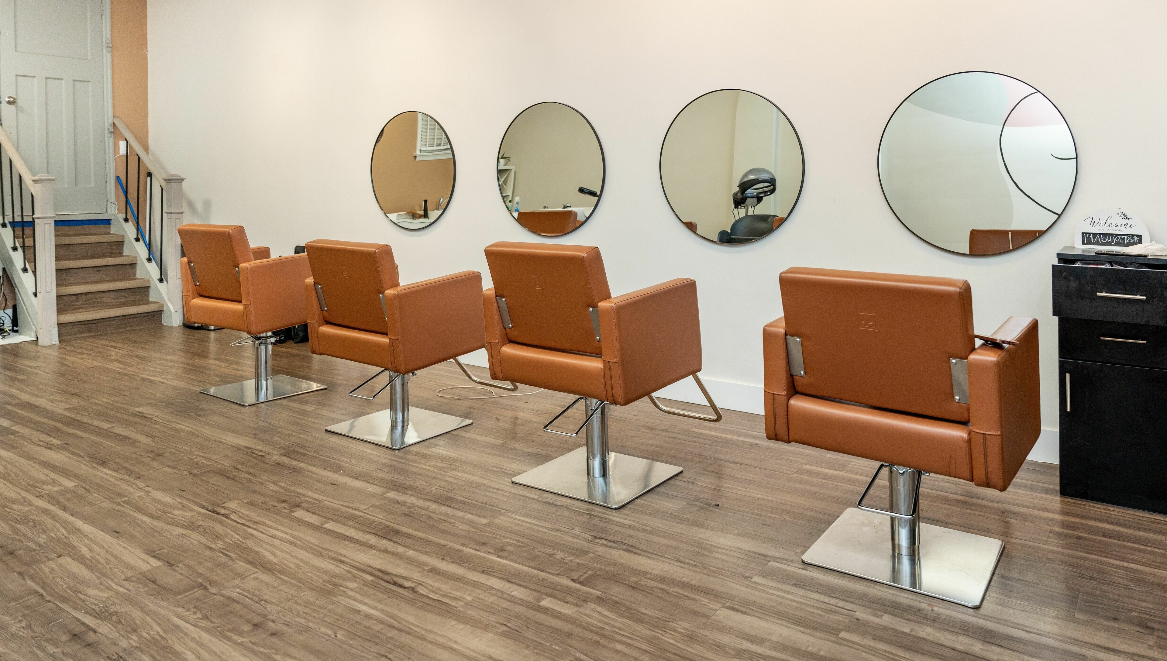 Modern salon chairs and mirrors at Locs by Jiji, Toronto, Ontario, CA.