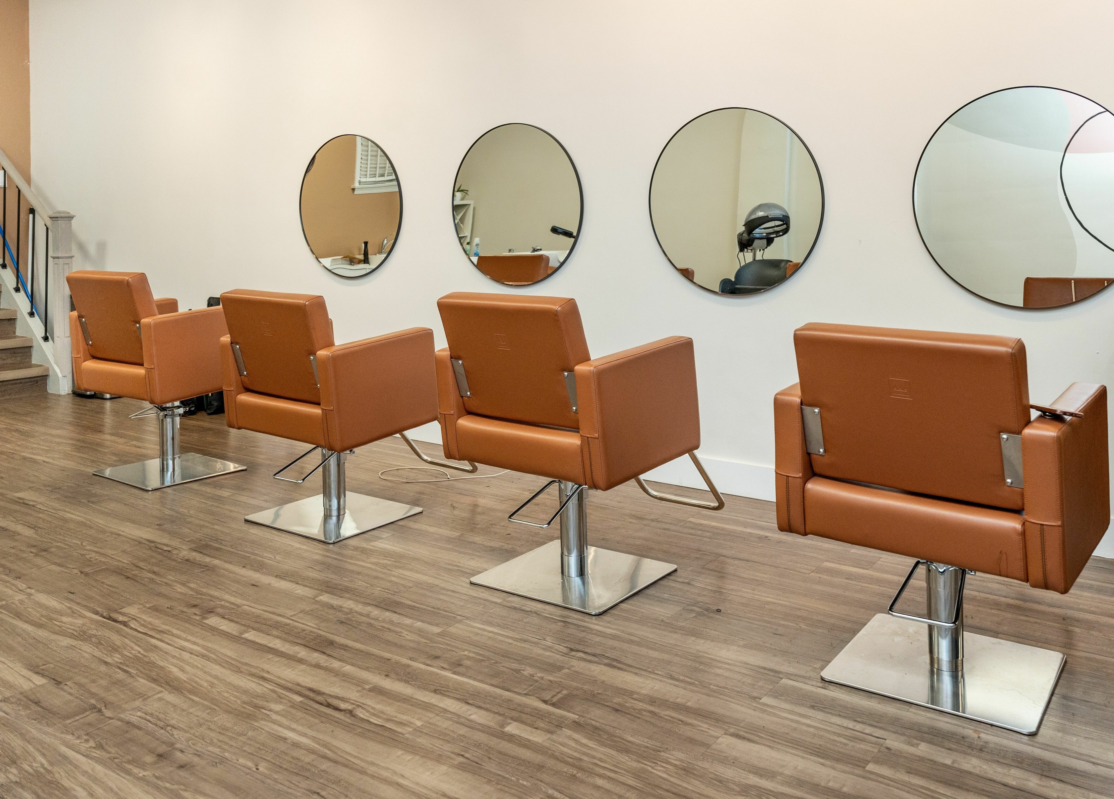 Modern salon chairs and mirrors at Locs by Jiji, Toronto, Ontario, CA.