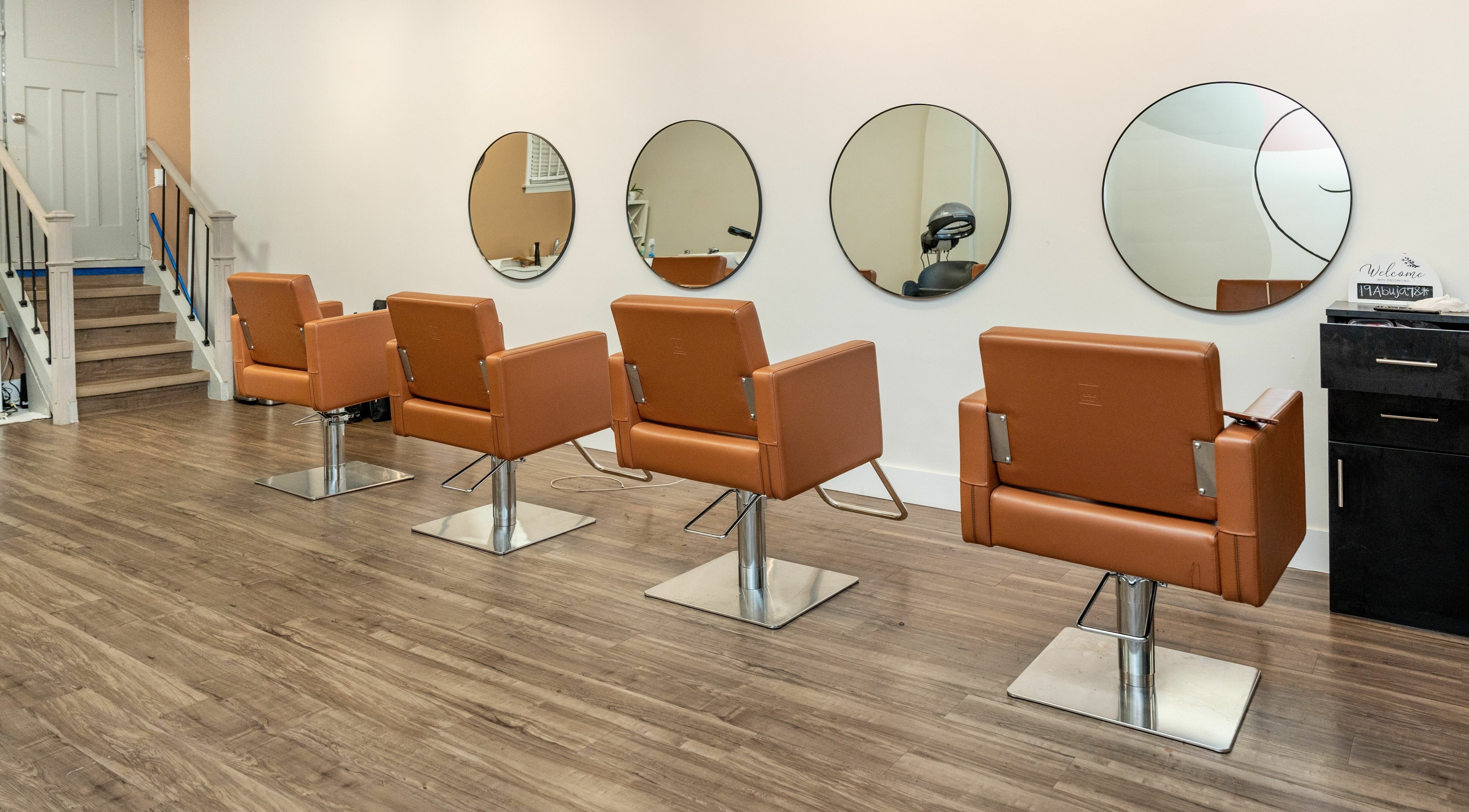 Modern salon chairs and mirrors at Locs by Jiji, Toronto, Ontario, CA.