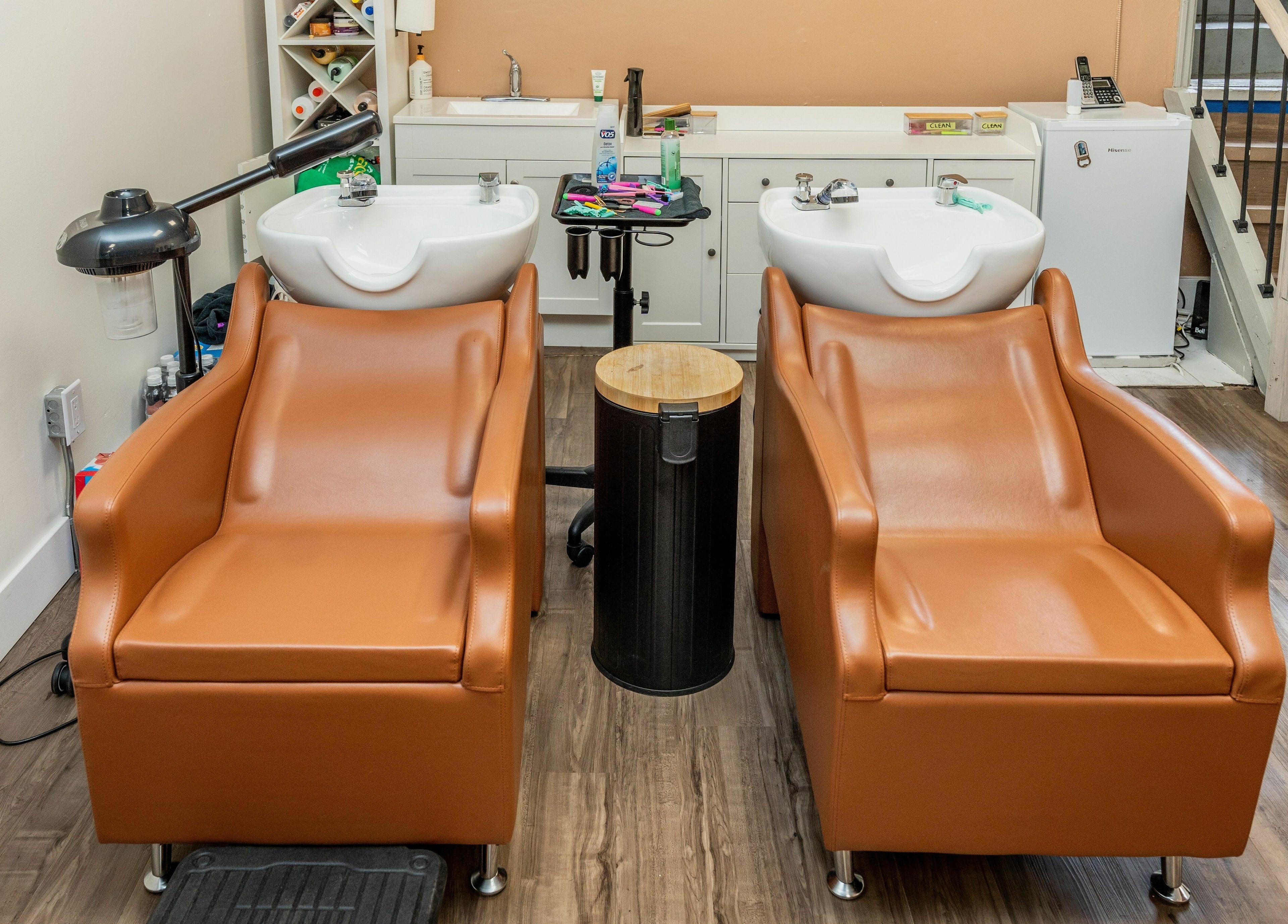 Modern wash stations at Locs by Jiji in Toronto, Ontario, CA offer comfort and style for clients.