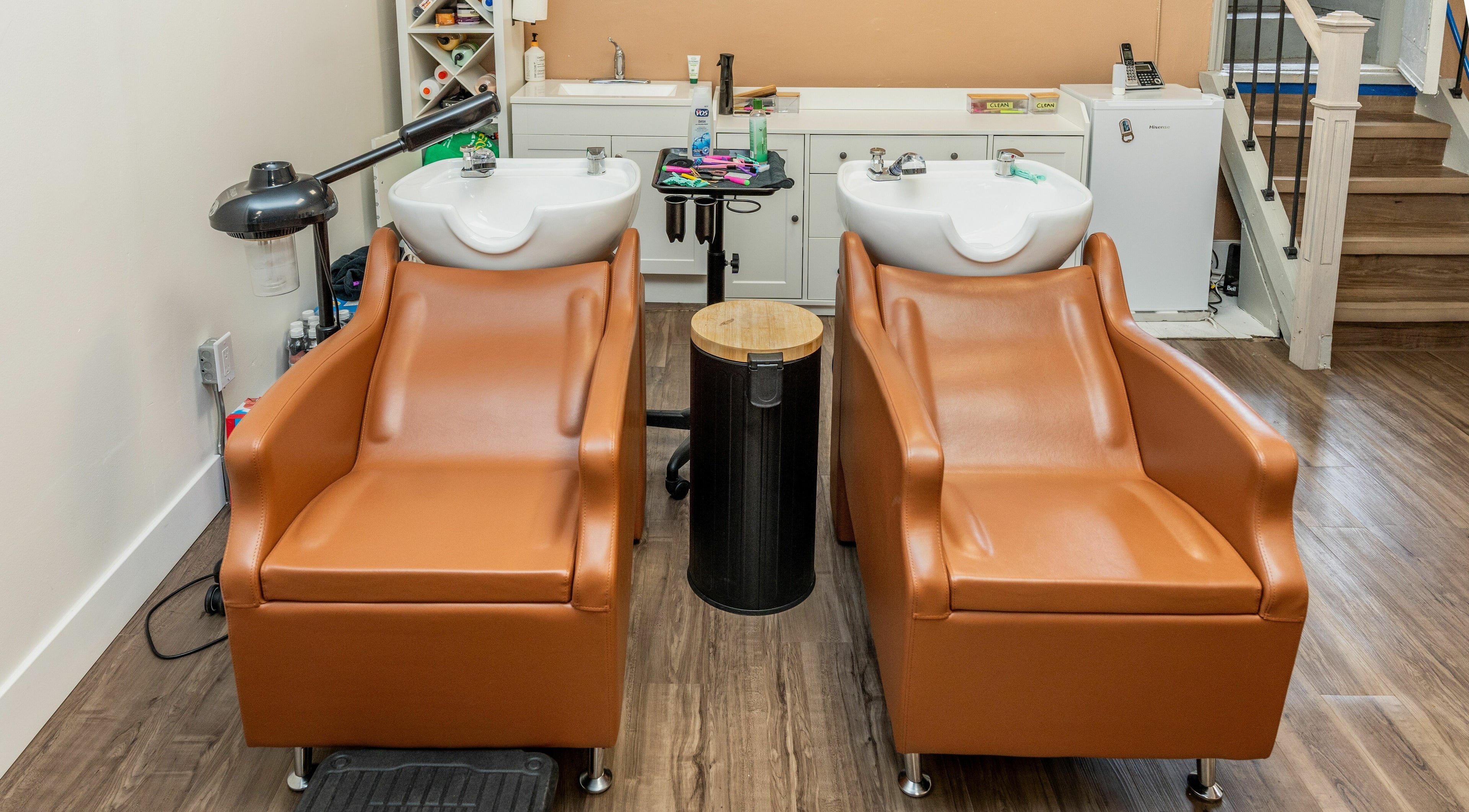 Modern wash stations at Locs by Jiji in Toronto, Ontario, CA offer comfort and style for clients.