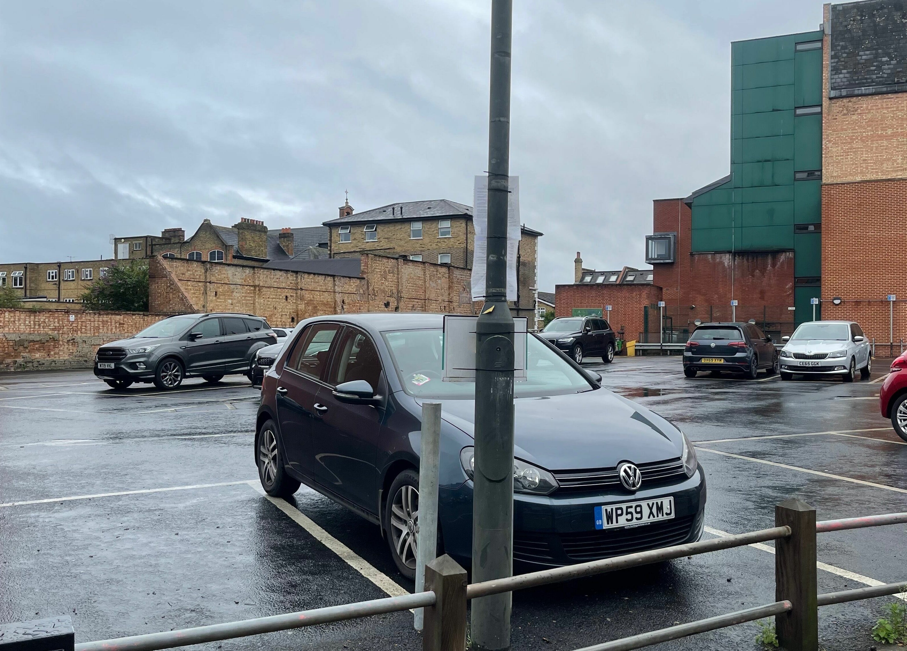 Parking area near Princess Nails Wimbledon, London, England, GB, with multiple parked cars.