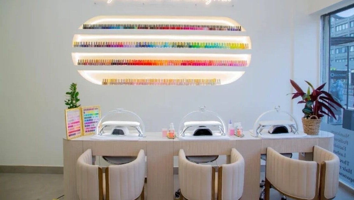 Modern nail station at The Beauty Nest in London, England, GB showcasing vibrant polish display.