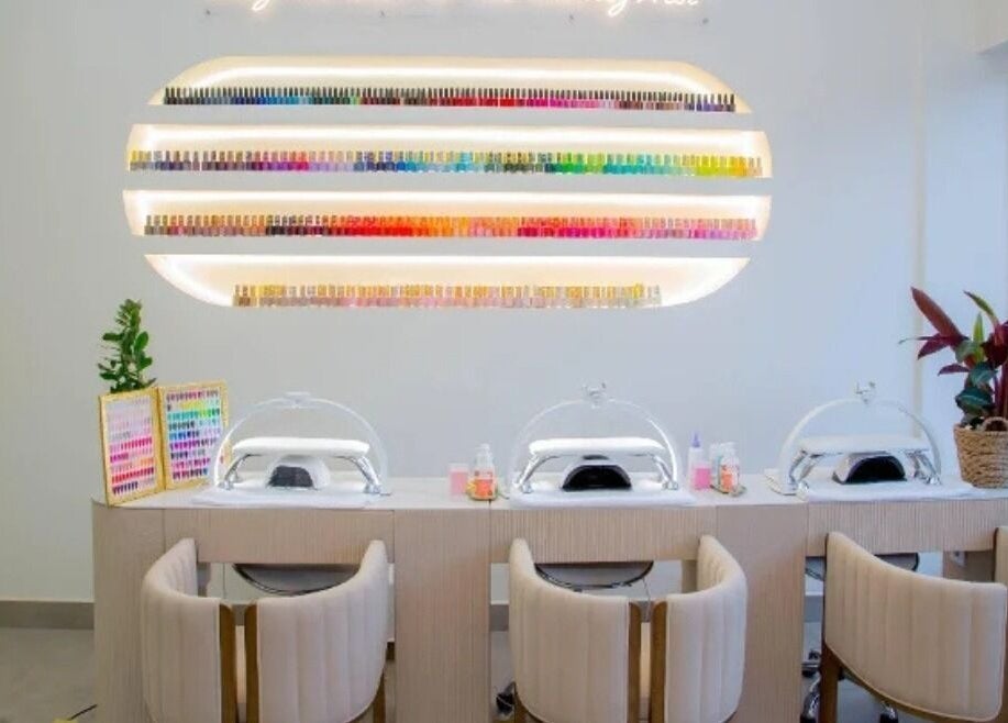 Modern nail station at The Beauty Nest in London, England, GB showcasing vibrant polish display.