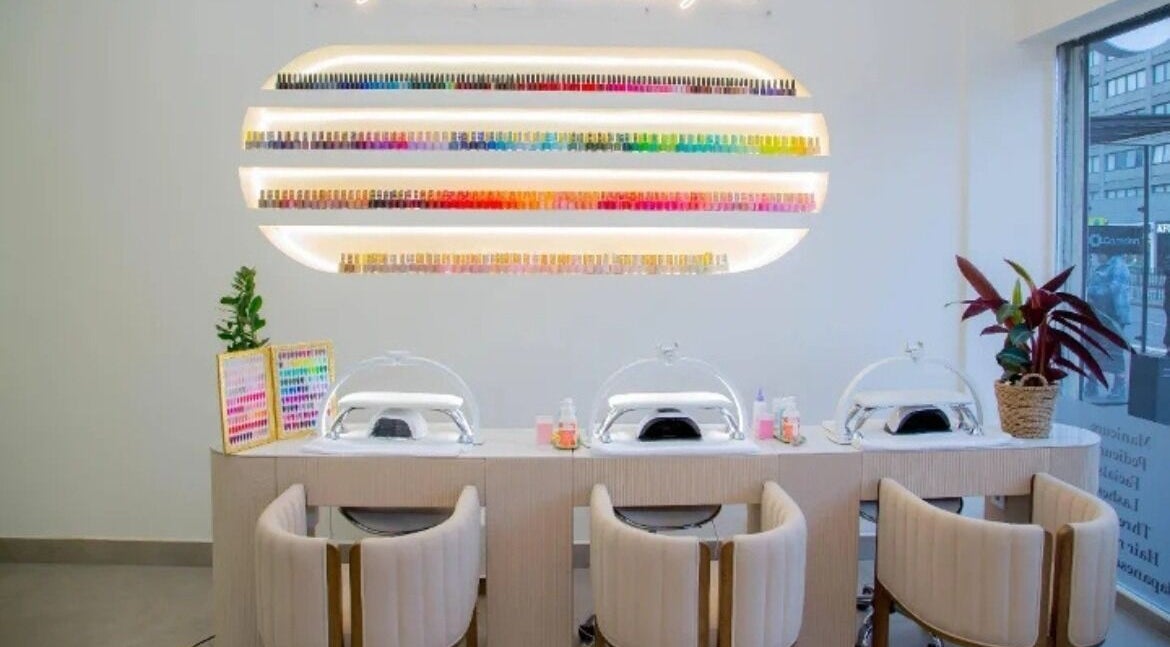 Modern nail station at The Beauty Nest in London, England, GB showcasing vibrant polish display.