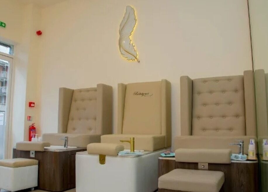 Luxurious pedicure station at The Beauty Nest, London, England, GB featuring plush, high-back chairs.