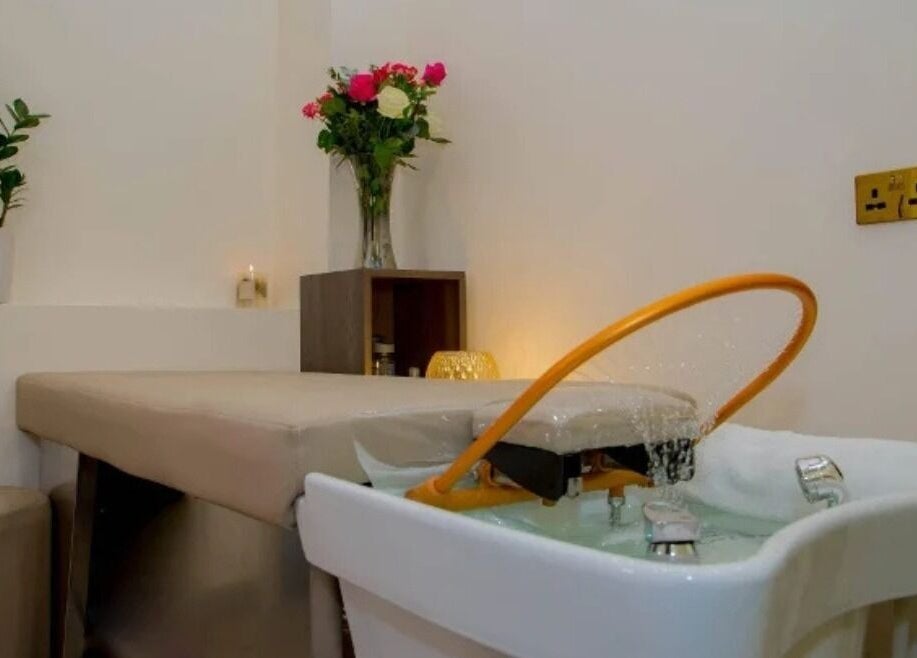 Luxury spa room at The Beauty Nest, London, England, GB, featuring a cozy treatment bed and relaxing decor.