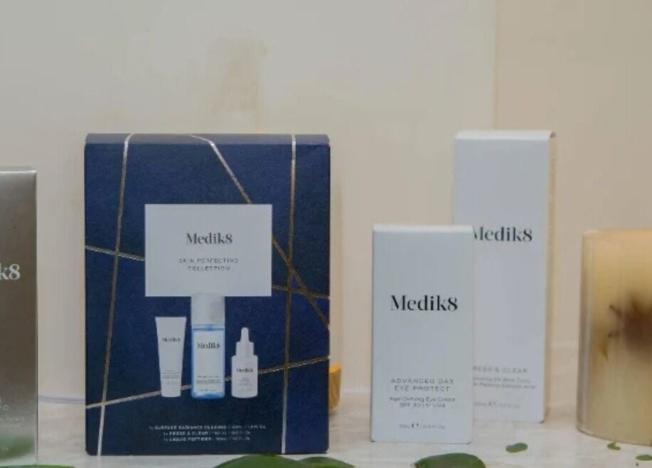 Medik8 skincare products and candle at The Beauty Nest, London, England, GB, offering serene elegance.