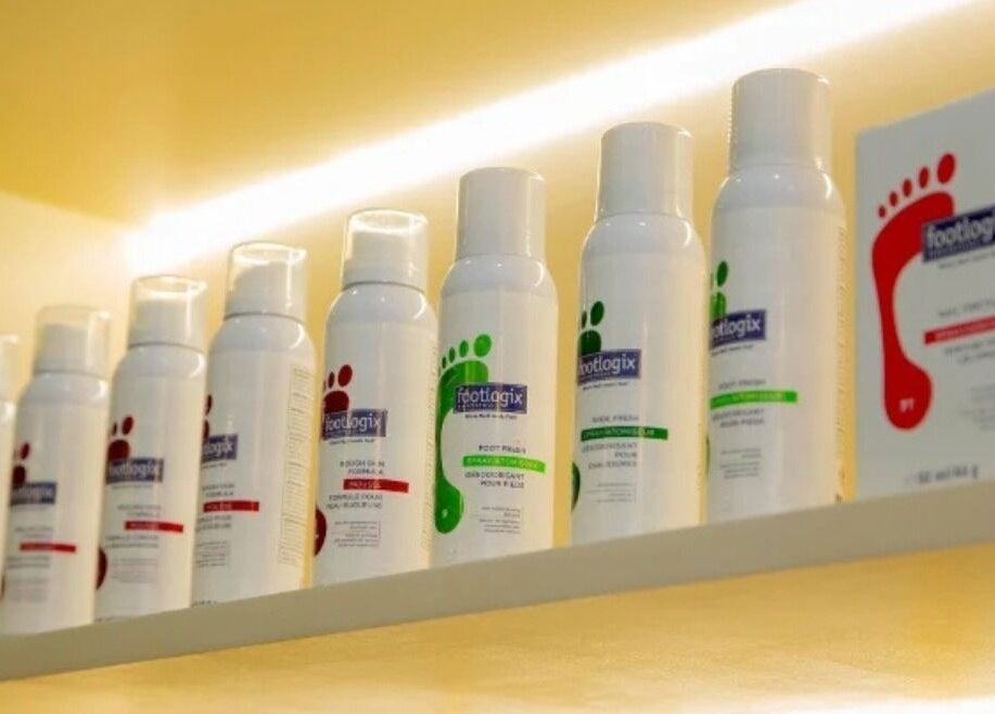 Foot care products displayed at The Beauty Nest, London, England, GB. Shelves showcase top wellness brands.