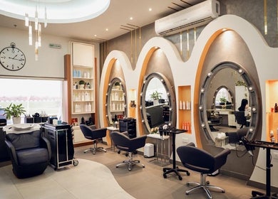 Bright, chic interior of Morya Beauty Centre in Sharjah, Sharjah, AE, featuring stylish salon stations.