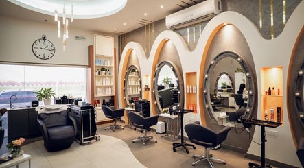 Bright, chic interior of Morya Beauty Centre in Sharjah, Sharjah, AE, featuring stylish salon stations.