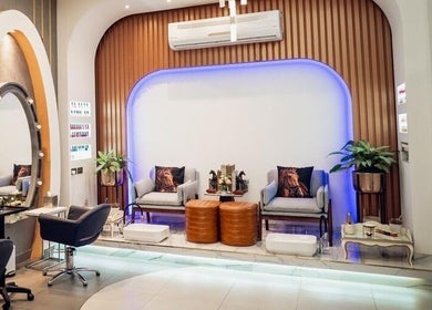 Relaxing seating area at Morya Beauty Centre in Sharjah, Sharjah, AE, showcasing modern decor and comfortable chairs.
