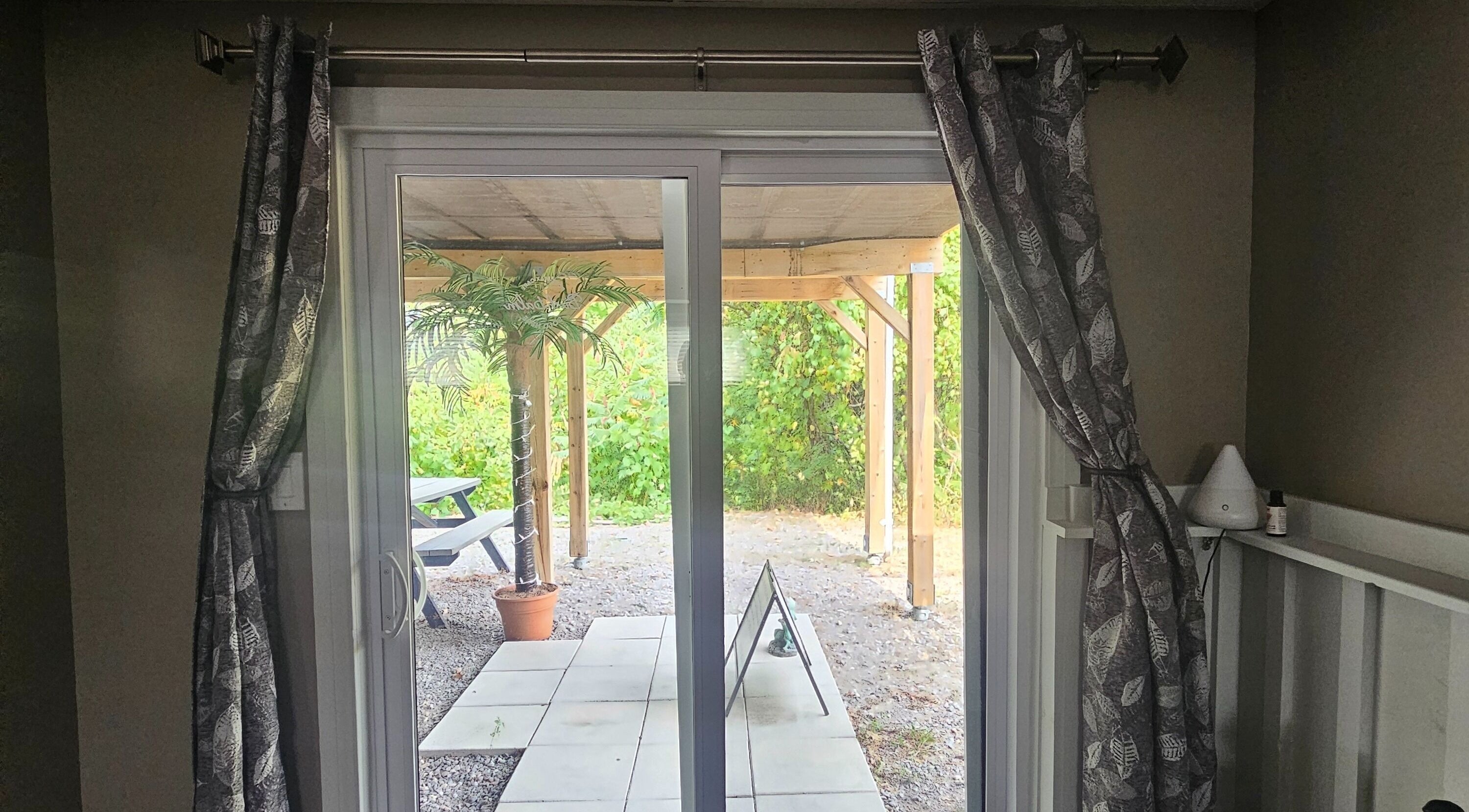 View of outdoor patio with greenery at Pure Waxing, Quinte West, Ontario, CA.
