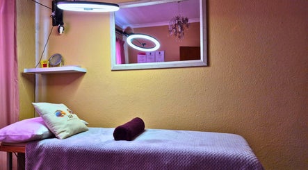 Tranquil treatment room at Leigh Kays Beauty, Cape Town, Western Cape, ZA with mirror and ambient lighting.