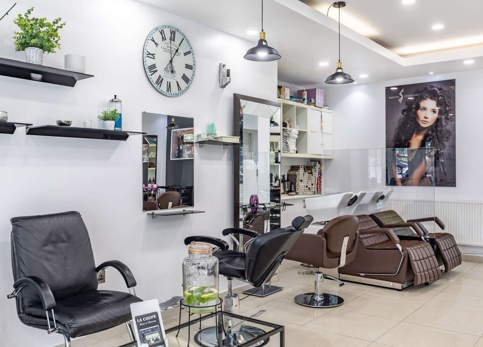 Interior of La Coupe in London, England, GB featuring modern salon chairs and stylish decor.