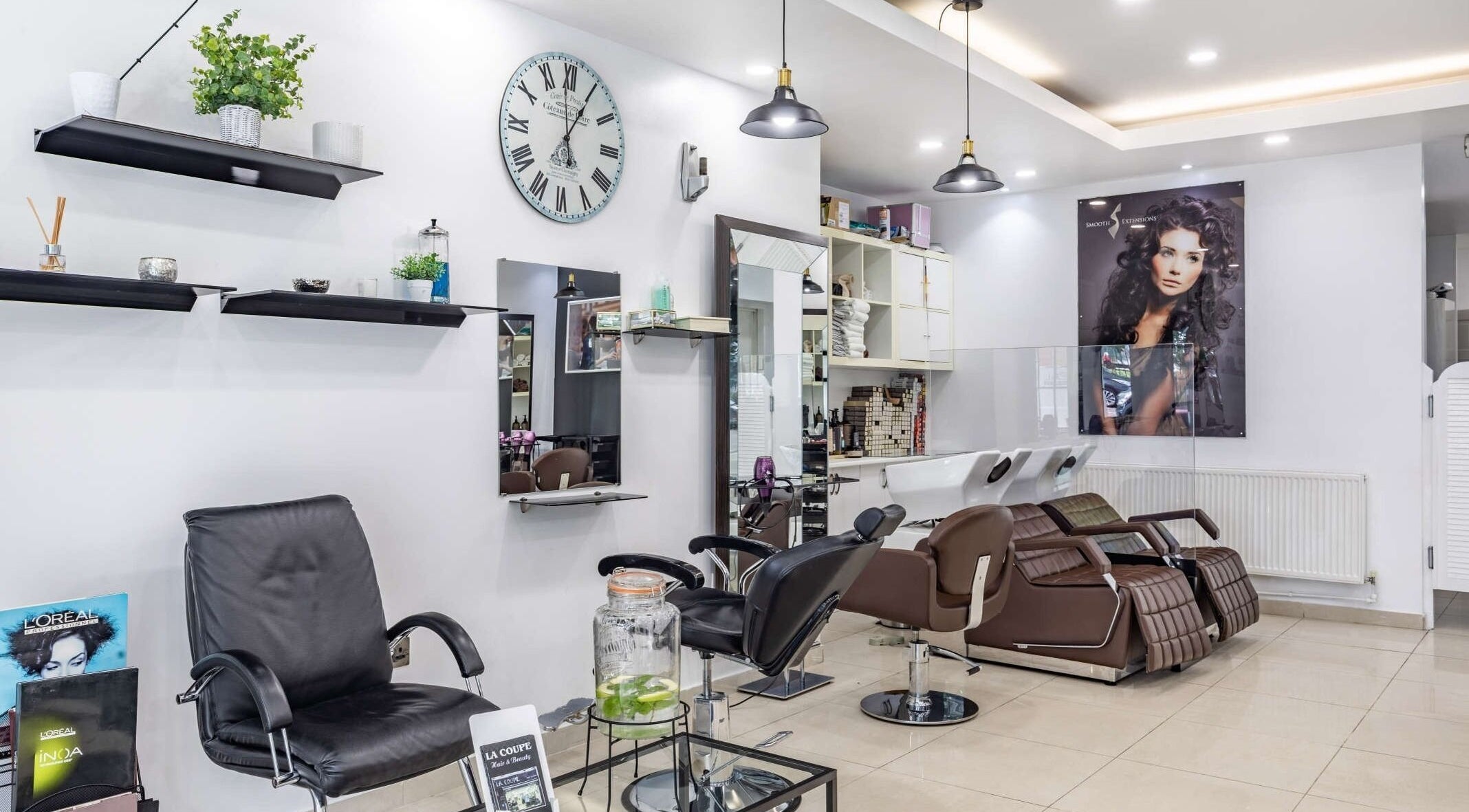 Interior of La Coupe in London, England, GB featuring modern salon chairs and stylish decor.