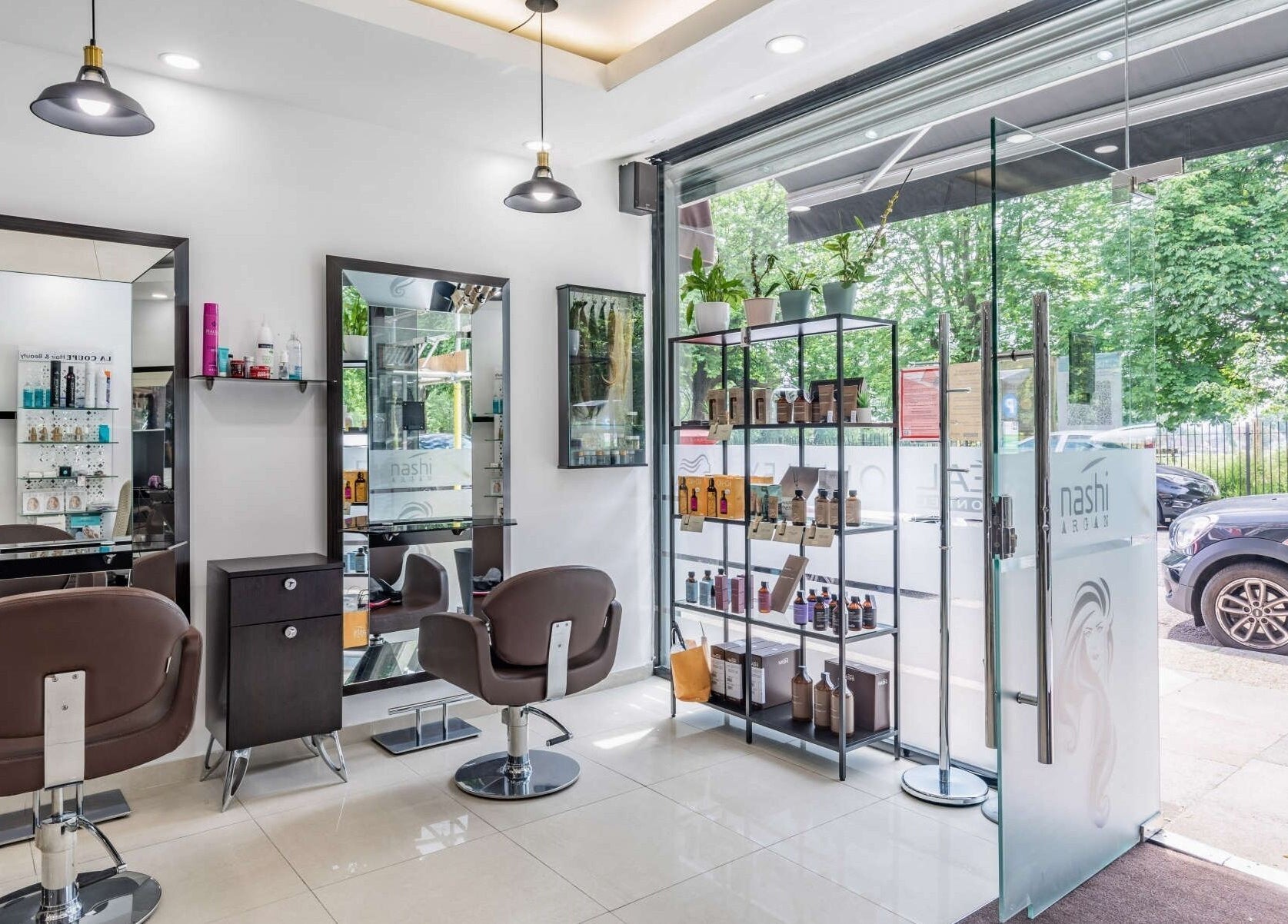 La Coupe salon interior with styling chairs and product display in London, England, GB.