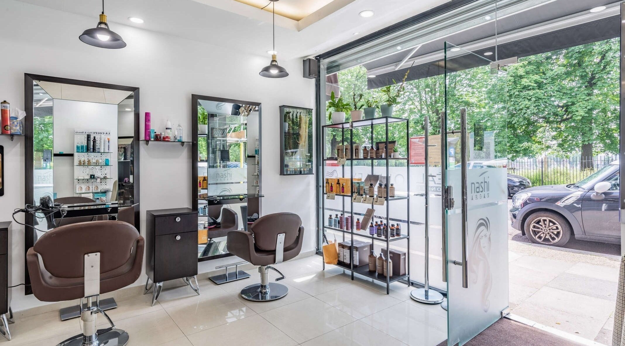 La Coupe salon interior with styling chairs and product display in London, England, GB.