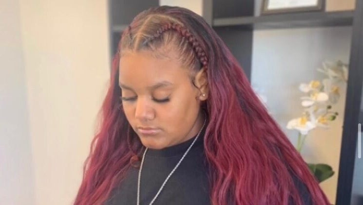 Stylish red braided hair at The Root Refresh Salon in Minneapolis, Minnesota, US.