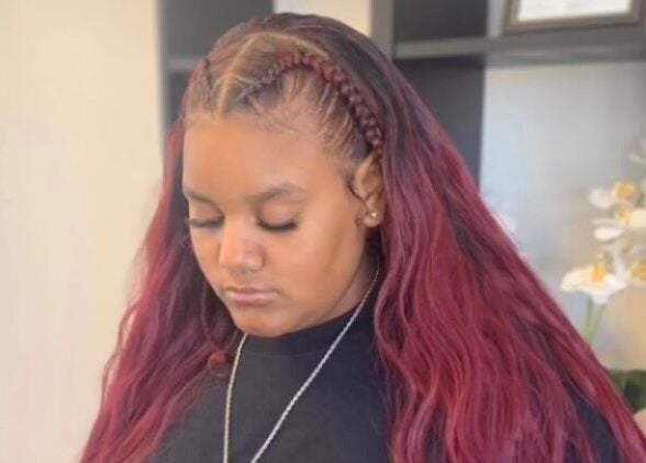 Stylish red braided hair at The Root Refresh Salon in Minneapolis, Minnesota, US.