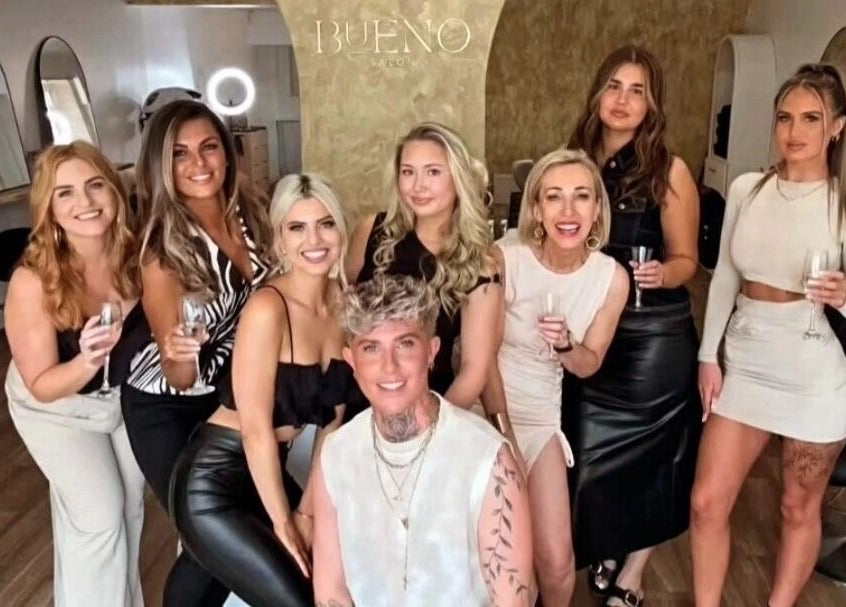 A happy group of people celebrating at U Aesthetics, South Elmsall, England, GB salon venue.