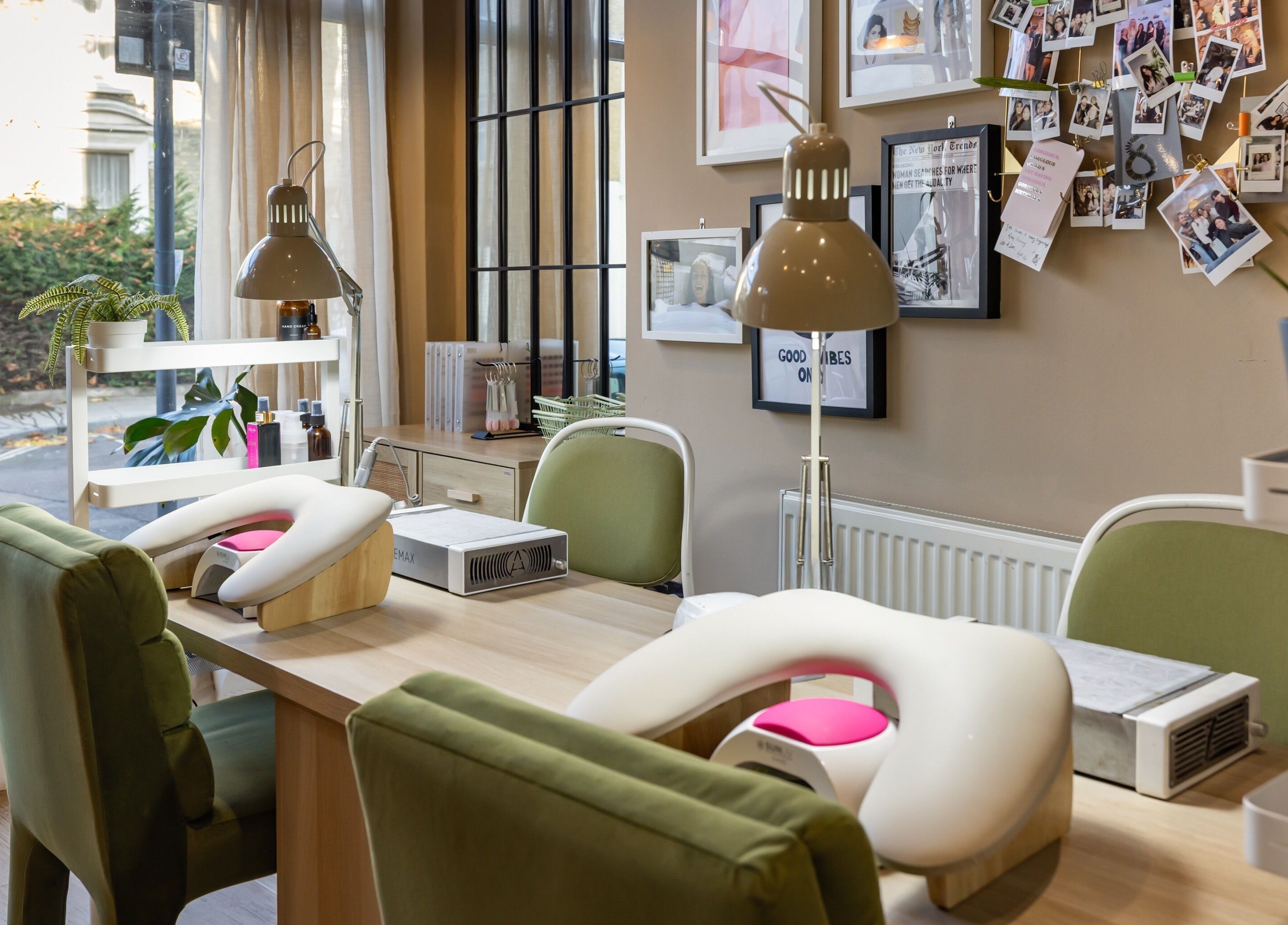 Inside Skip The Filter Fulham Beauty, a stylish nail station in London, England, GB with green chairs and decor.