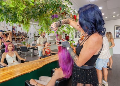 Stylist working on vibrant hair at Chameleon New Age Salon in Surfers Paradise, Queensland, AU.