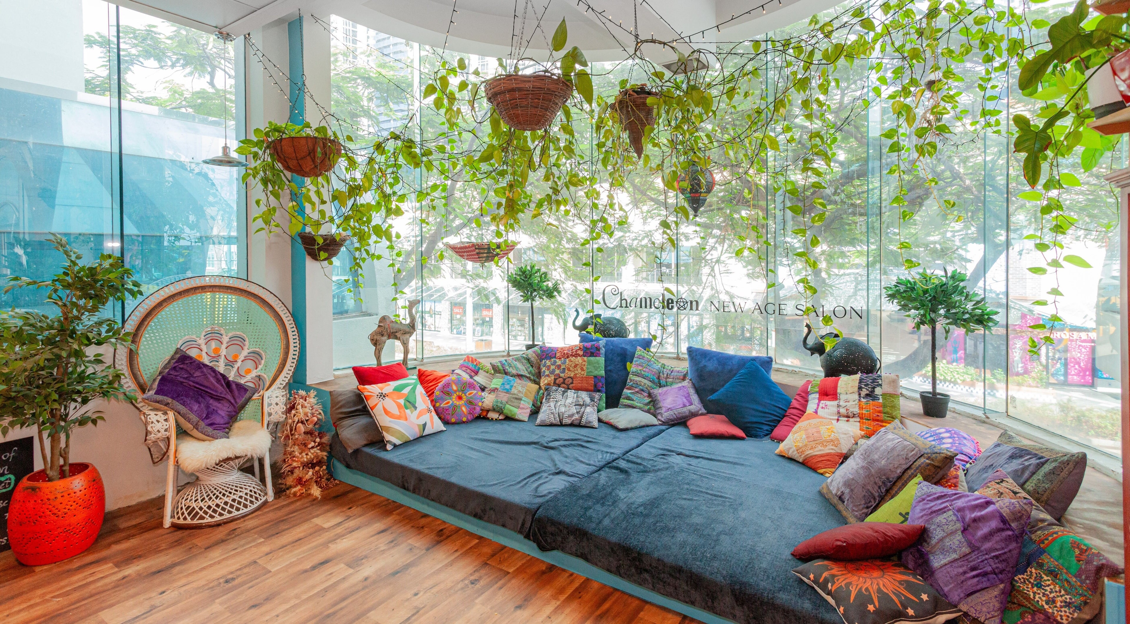 Cozy boho lounge with vibrant cushions at Chameleon New Age Salon, Surfers Paradise, Queensland, AU.