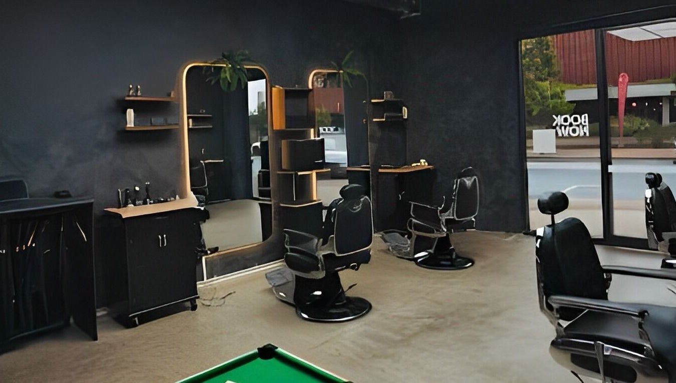 Chic interior of First Rule Barber, Sippy Downs, Queensland, AU, featuring modern barber chairs and mirrors.