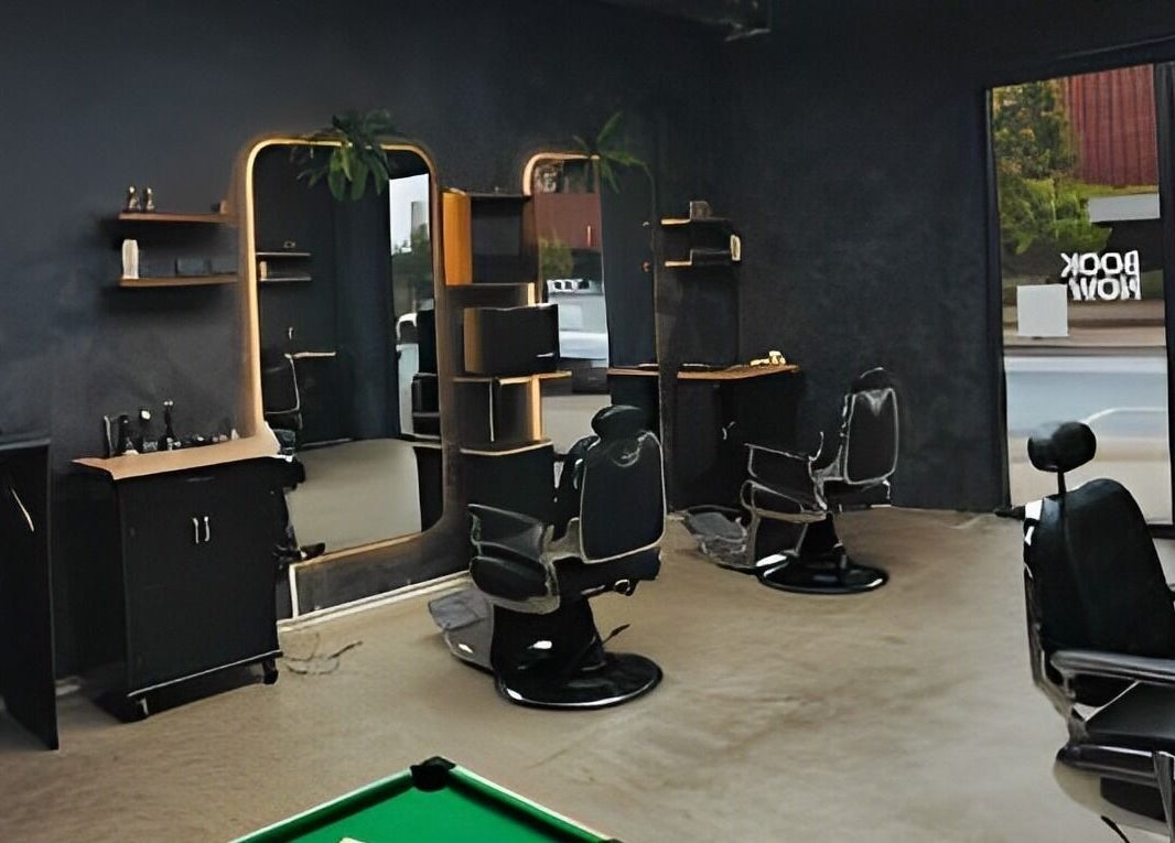 Chic interior of First Rule Barber, Sippy Downs, Queensland, AU, featuring modern barber chairs and mirrors.