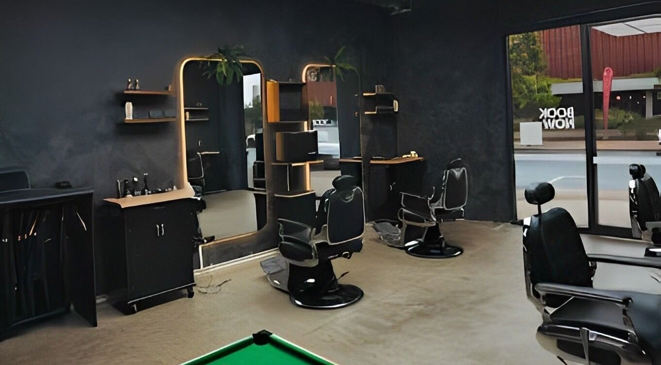 Chic interior of First Rule Barber, Sippy Downs, Queensland, AU, featuring modern barber chairs and mirrors.