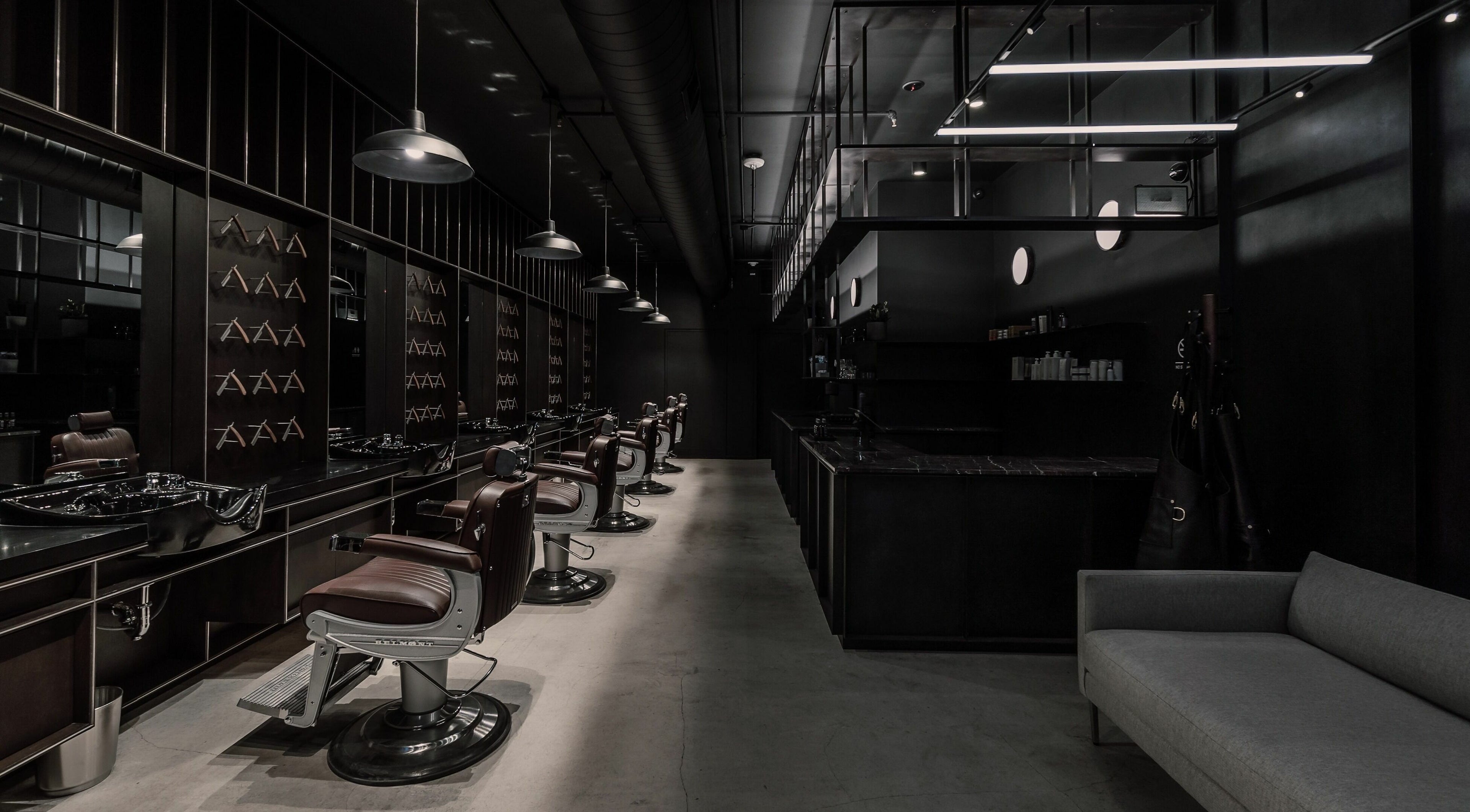 Sleek barber chairs and modern interior at NoMad, New York, New York, US.
