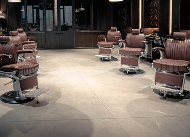 Elegant barber chairs at Grand Central, New York, New York, US, offering premium grooming services.
