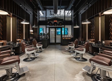 Sleek brown barber chairs in stylish Grand Central salon, New York, New York, US artfully arranged.