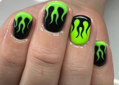 Close-up of neon green flame nail art by Nails by TyneJane, Wigan, England, GB.