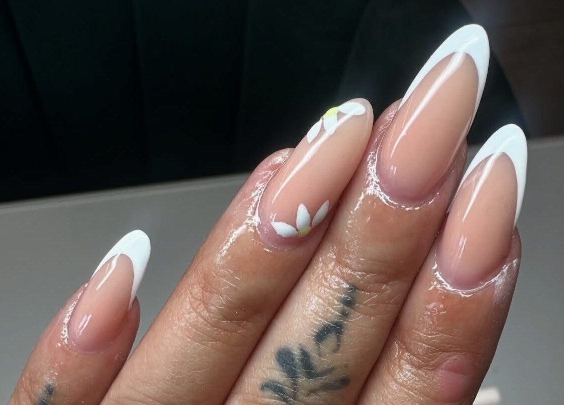 Stunning floral nail design from Nails by TyneJane in Wigan, England, GB showcasing white flower accents.