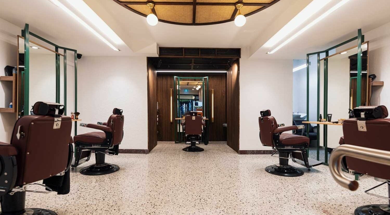 Interior of Barber Industries QVB in Sydney, New South Wales, AU featuring traditional barbershop chairs.