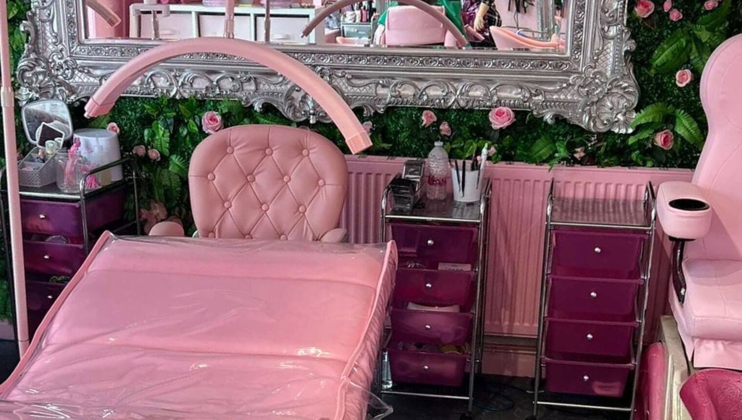 Luxurious pink beauty room at L.C Beauty and Aesthetics, Wigan, England, GB with ornate mirror and plush chairs.