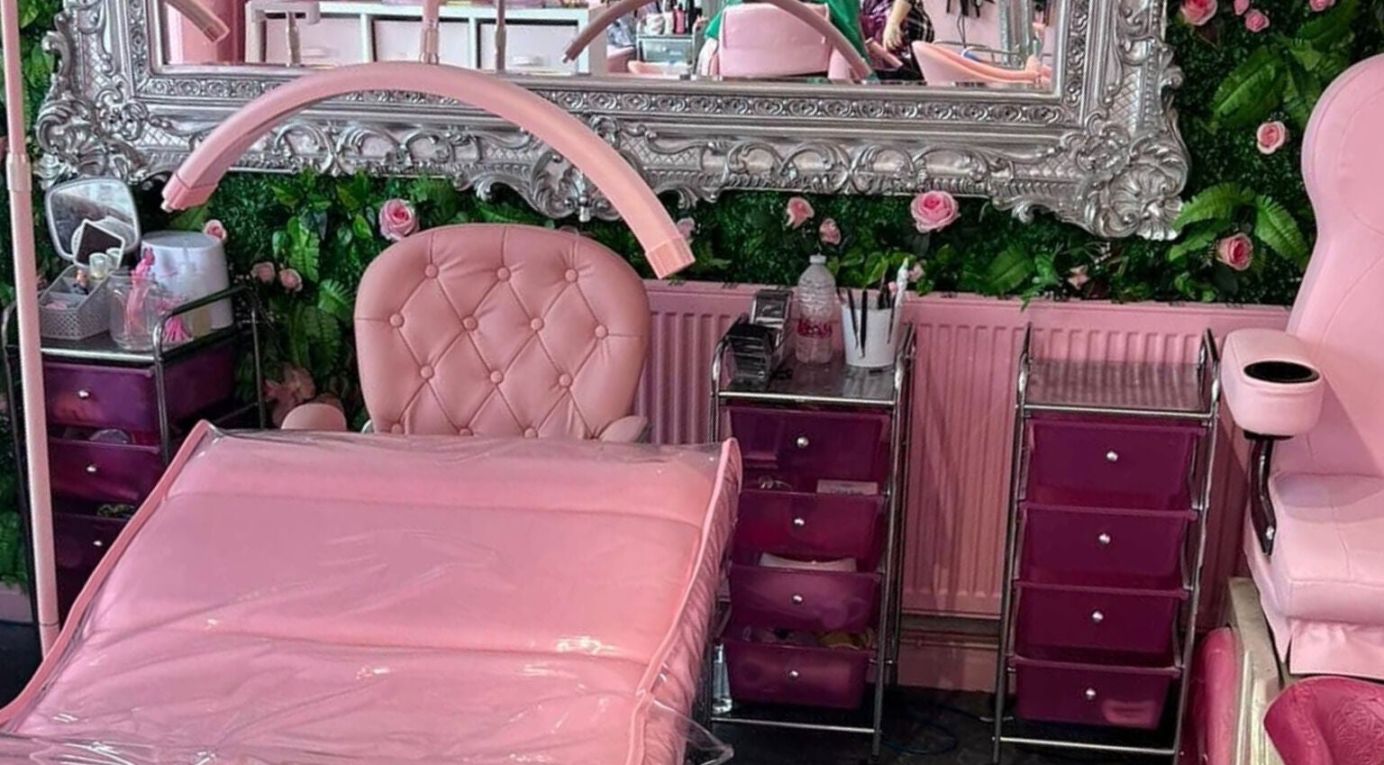 Luxurious pink beauty room at L.C Beauty and Aesthetics, Wigan, England, GB with ornate mirror and plush chairs.