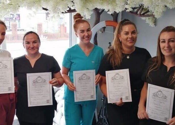 Team at L.C Beauty and Aesthetics in Wigan, England proudly display their beauty certificates.