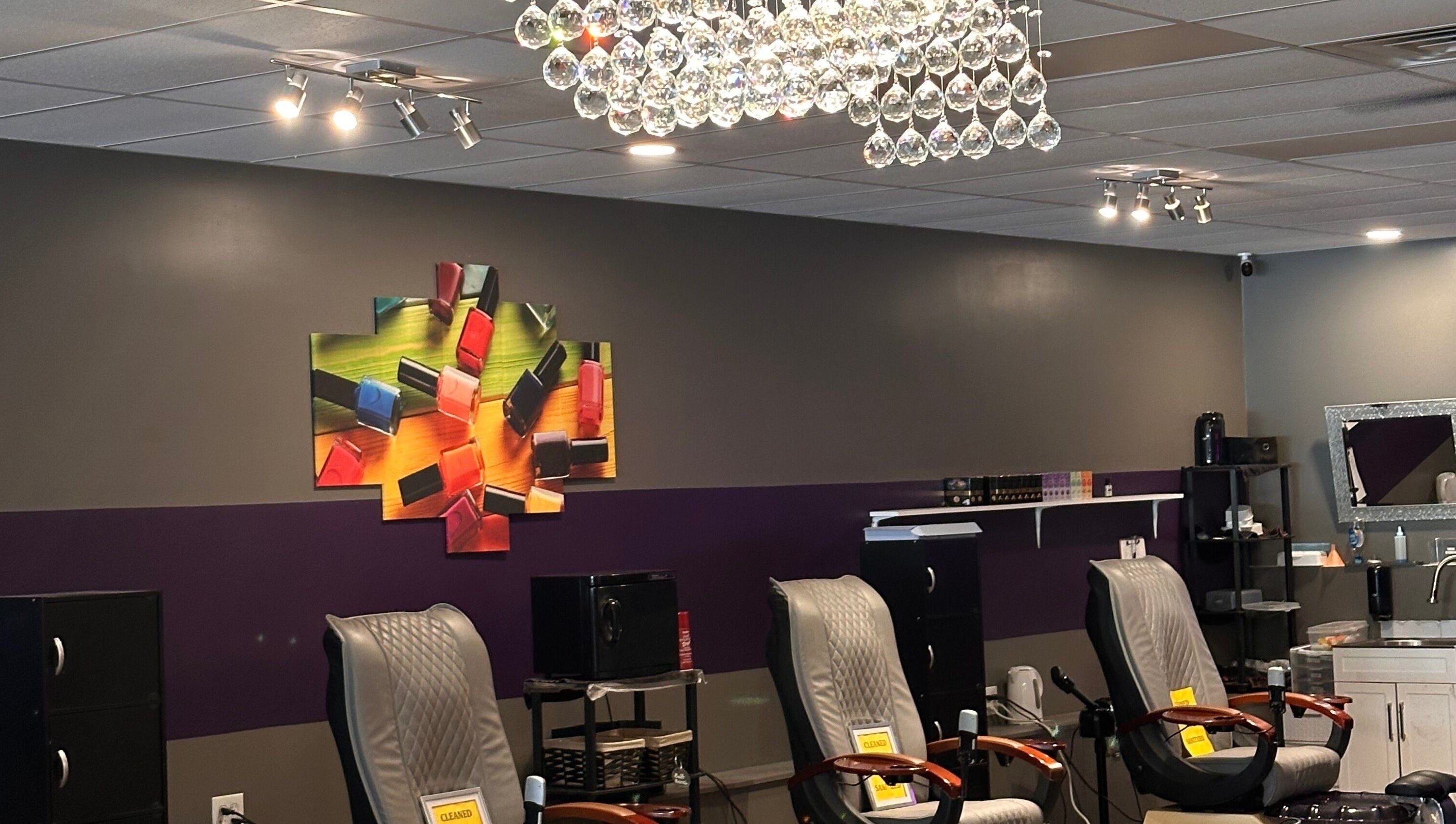 Chic nail salon with plush chairs and vibrant art at D’yVonne’s Nails and Beauty Bar, Forest Park, Georgia, US.