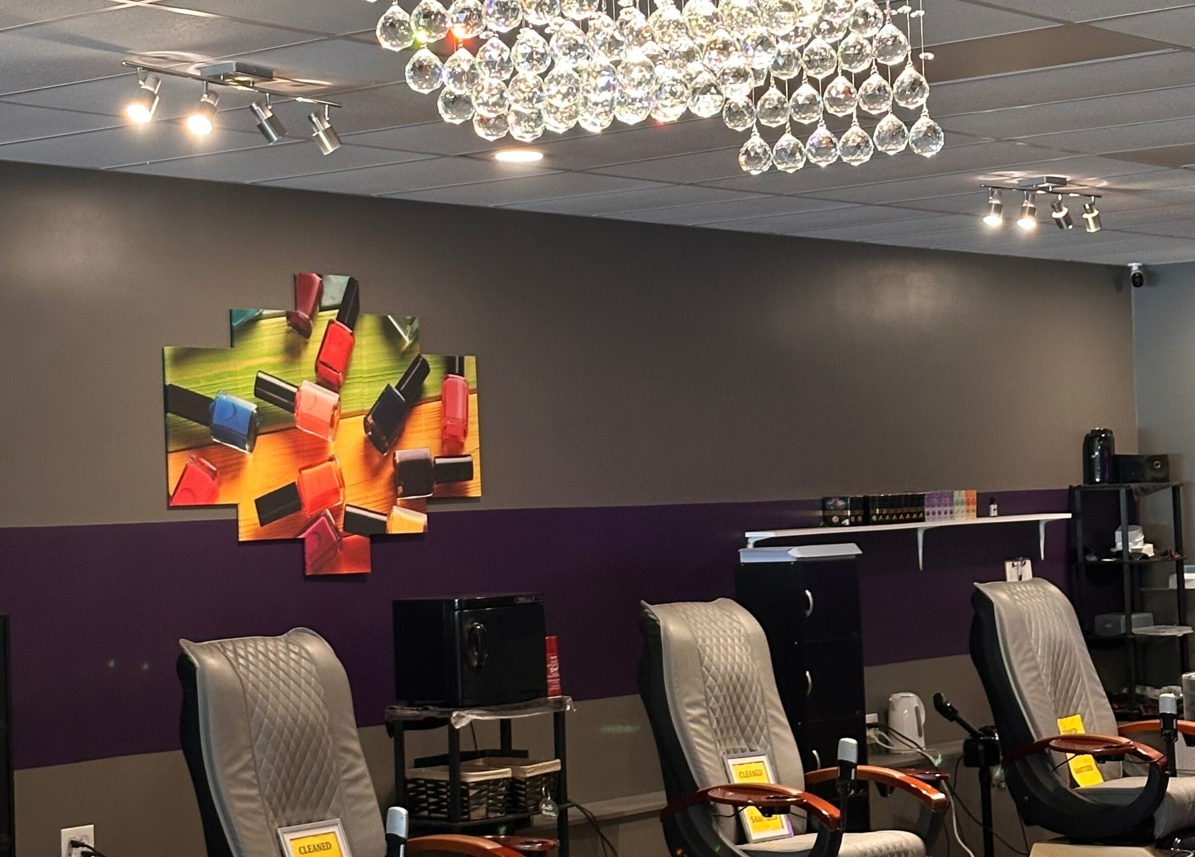 Chic nail salon with plush chairs and vibrant art at D’yVonne’s Nails and Beauty Bar, Forest Park, Georgia, US.