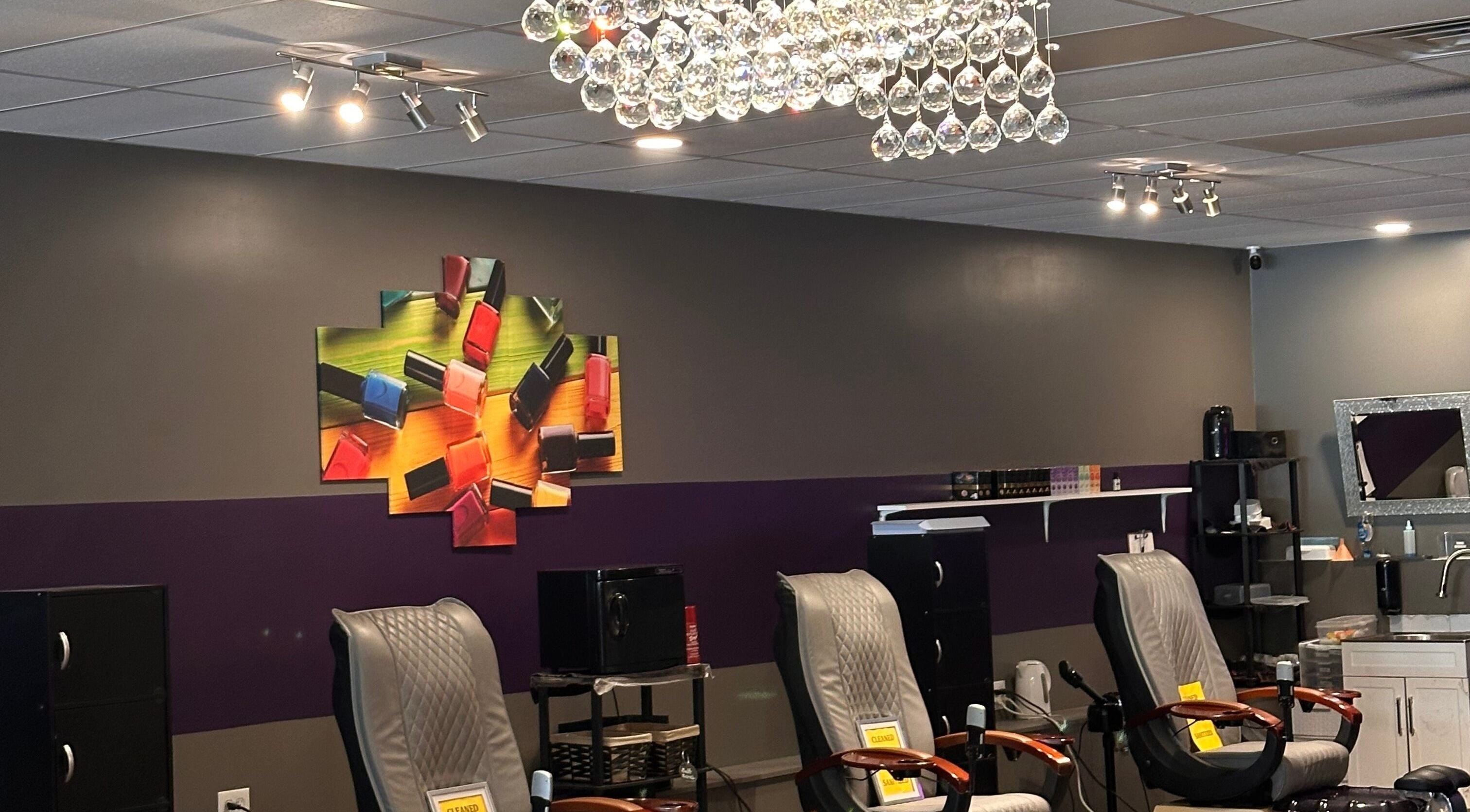 Chic nail salon with plush chairs and vibrant art at D’yVonne’s Nails and Beauty Bar, Forest Park, Georgia, US.